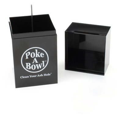 A black, box-shaped ashtray with the lid removed is shown. The ashtray is labeled "Poke A Bowl - Clean Your Ash Hole" on the side in white text. The lid is placed beside the ashtray on the right, and a thin metal poker is visible inside the ashtray.