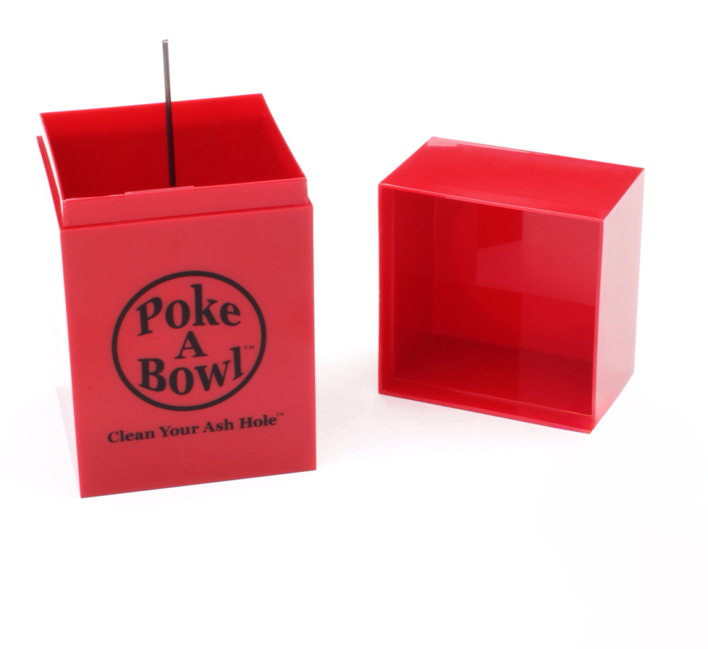 A red, box-shaped ashtray with the lid removed is shown. The ashtray is labeled "Poke A Bowl - Clean Your Ash Hole" on the side in white text. The lid is placed beside the ashtray on the right, and a thin metal poker is visible inside the ashtray.